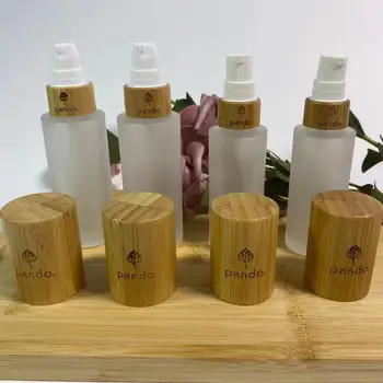 Toptan Özel Logo Kozmetik Buzlu Cam Sprey Şişesi Makyaj Ahşap Tahıl Bambu Kap Emülsiyon Pompası Konteyner Ambalaj